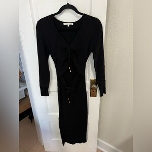 Knit dress with cutout and ties at front. Fits a M/L.